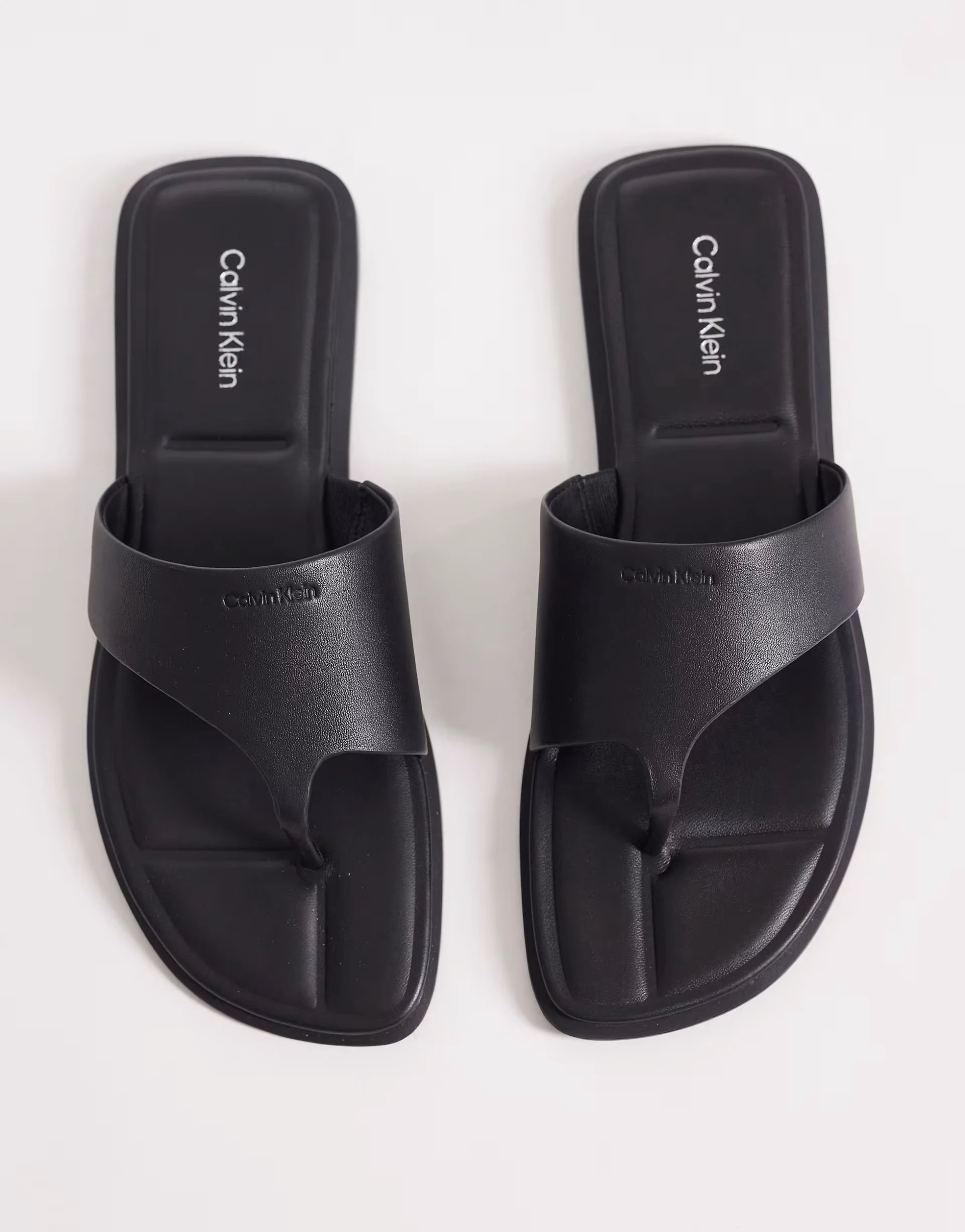 Calvin Klein Jeans leather flat flip flop sandals in black